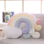 Coussin enfant en forme d'arc en ciel captivant