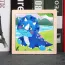 Puzzle enfant en bois avec une image de triceratops bleu 