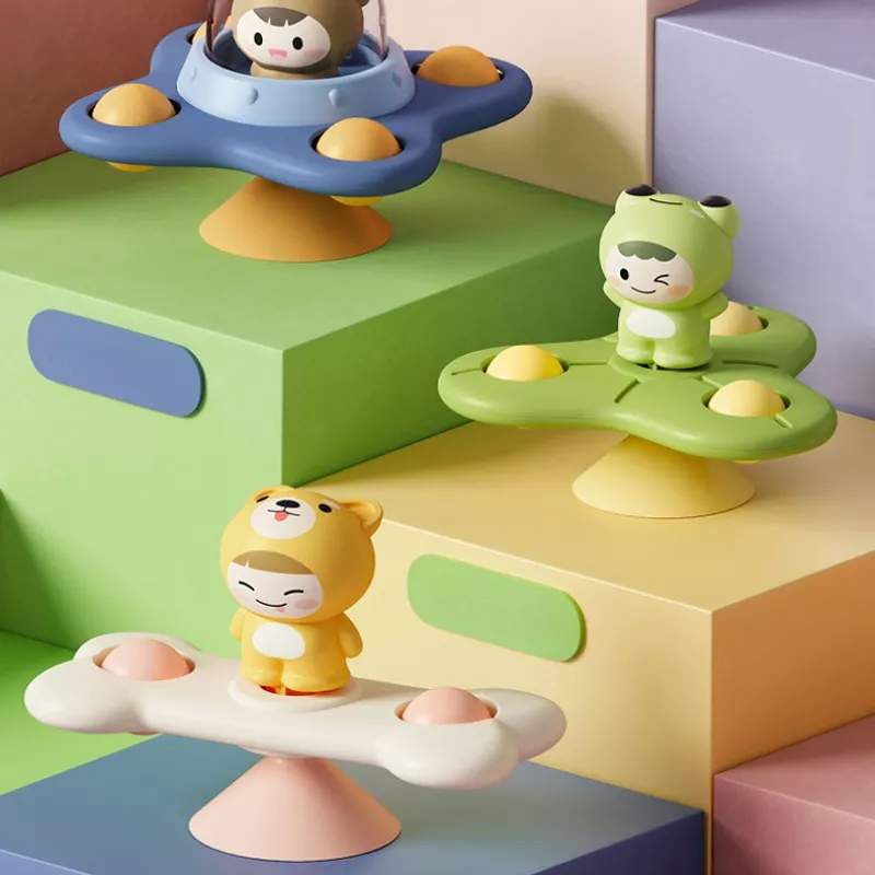 Hochet bébé toupie de doigt coloré avec ventouse